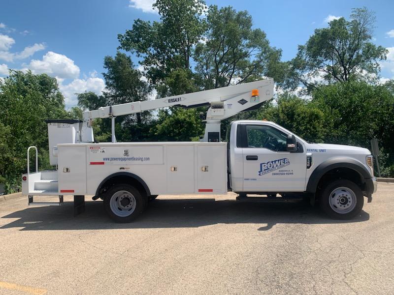 Versalift Truck Parked On A Parking Lot — Naperville, IL — Power Equipment Leasing Co.